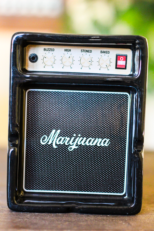 Ashtray that looks like a speaker with Marijuana written across it.